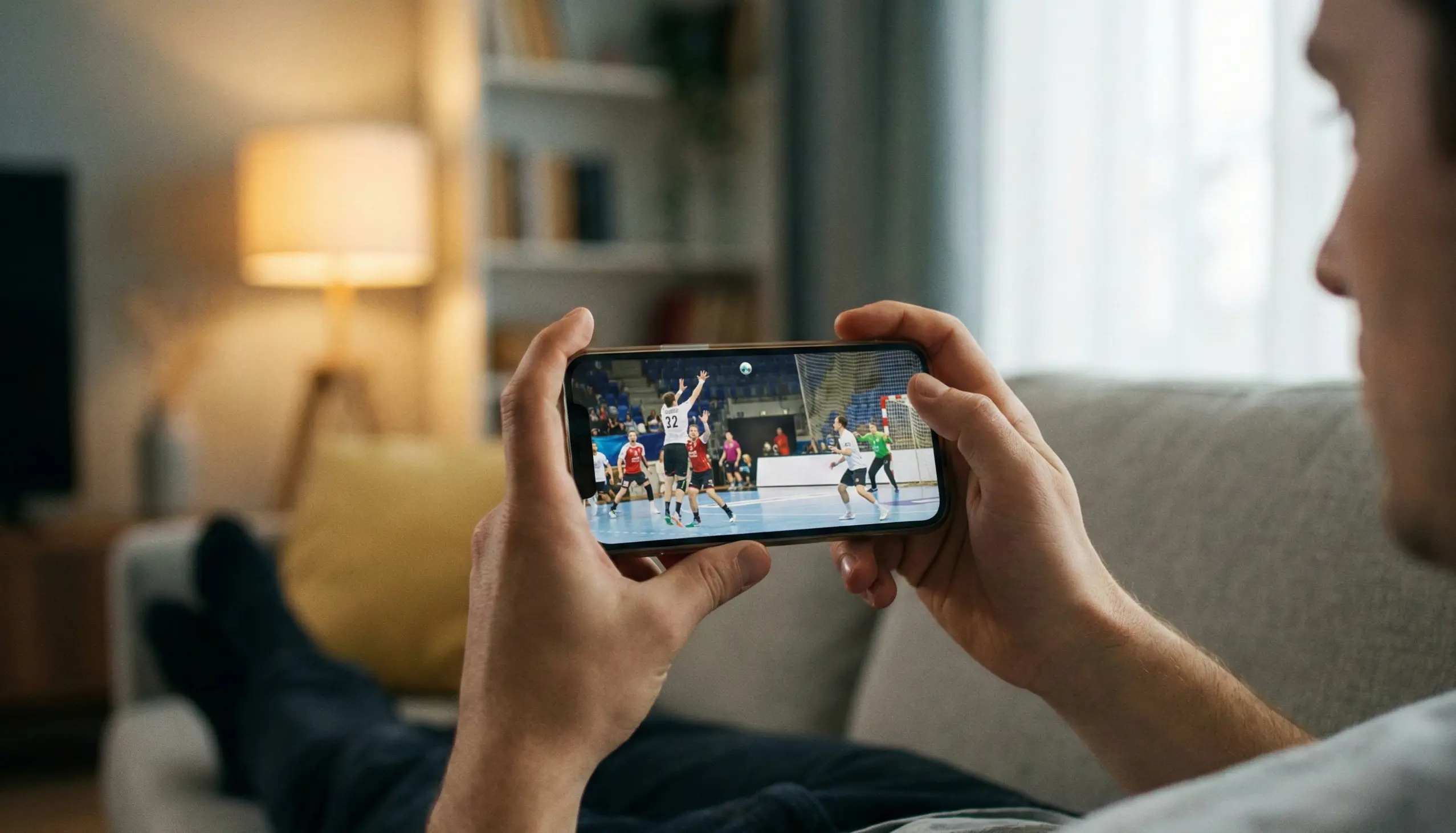 Handball-Spiel auf Smartphone während Livewetten